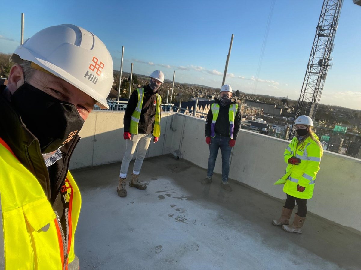 people standing upon an building site