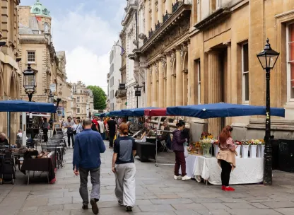 Market stands outside historical buildings in Bristol