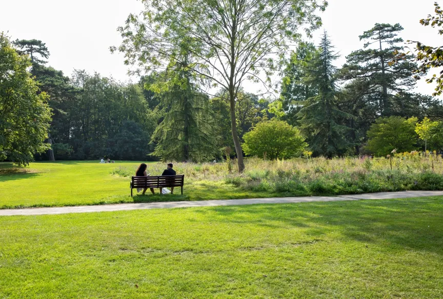 man and woman sitting on a bench in fulbourn