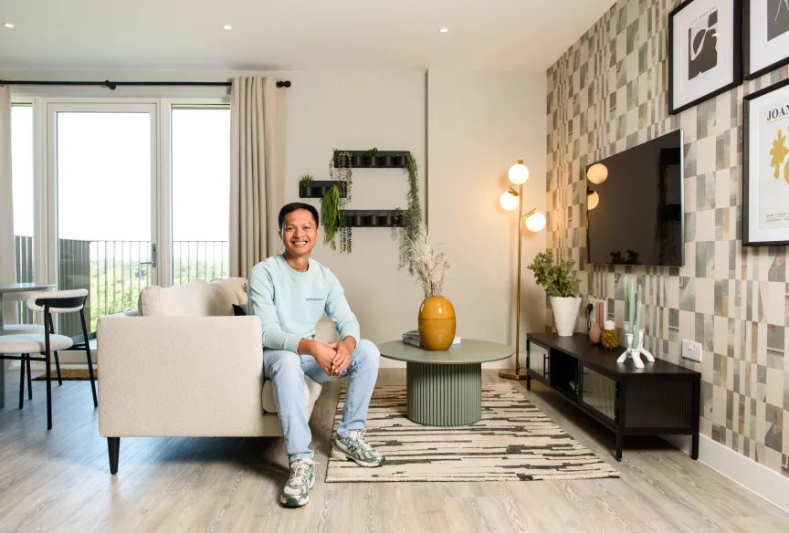 Lampton Resident sitting on sofa