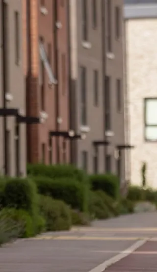 Young woman cycling through the grounds at Marleigh Park development