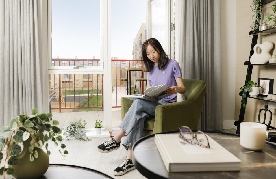 Woman reading in new build
