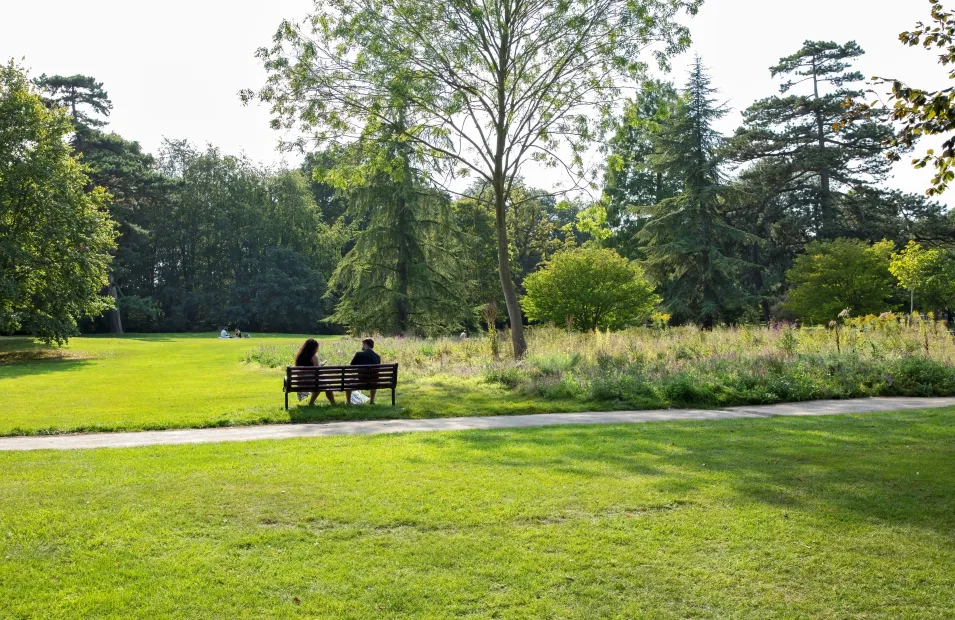 man and woman sitting on a bench in fulbourn