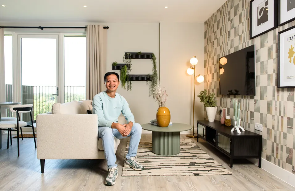 Lampton Resident sitting on sofa