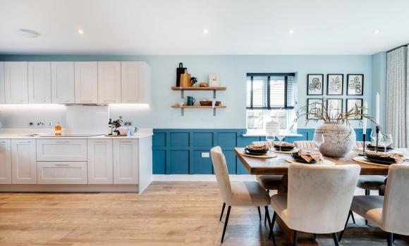 A bright kitchen and dining space at Farehurst Park New Build Homes development by Hill