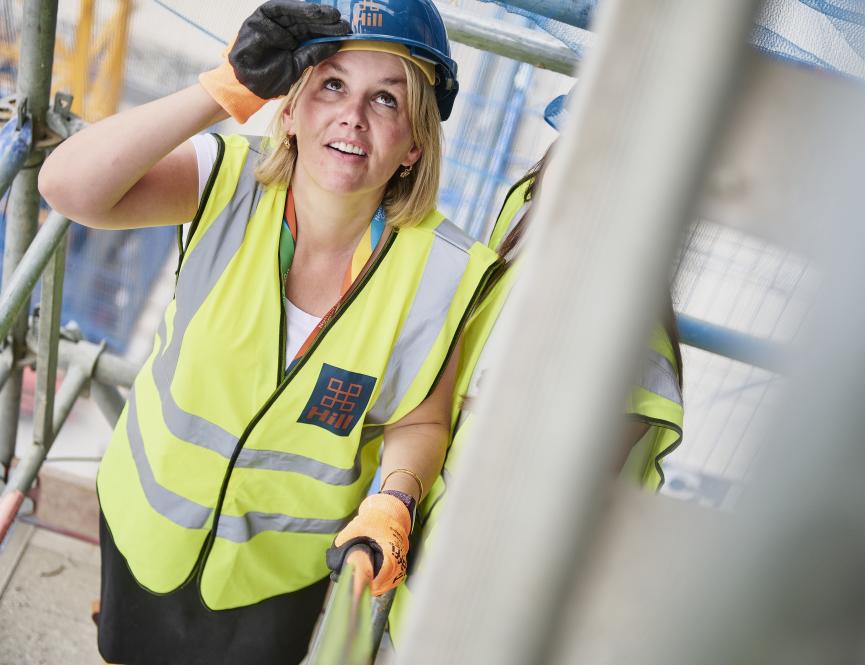 Women climbing stairs in ppe