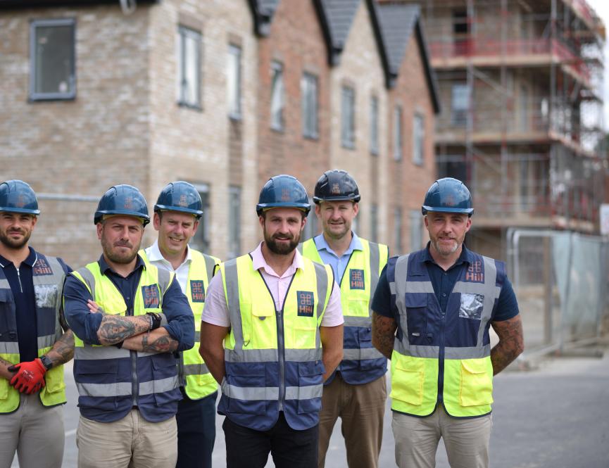 Men gathered at Campkin topping out 