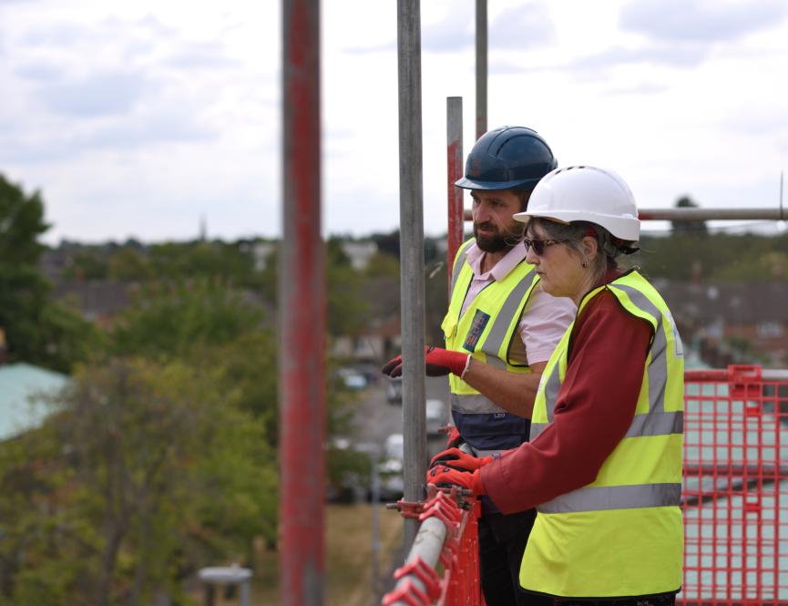 Man and woman at topping out ceremony 