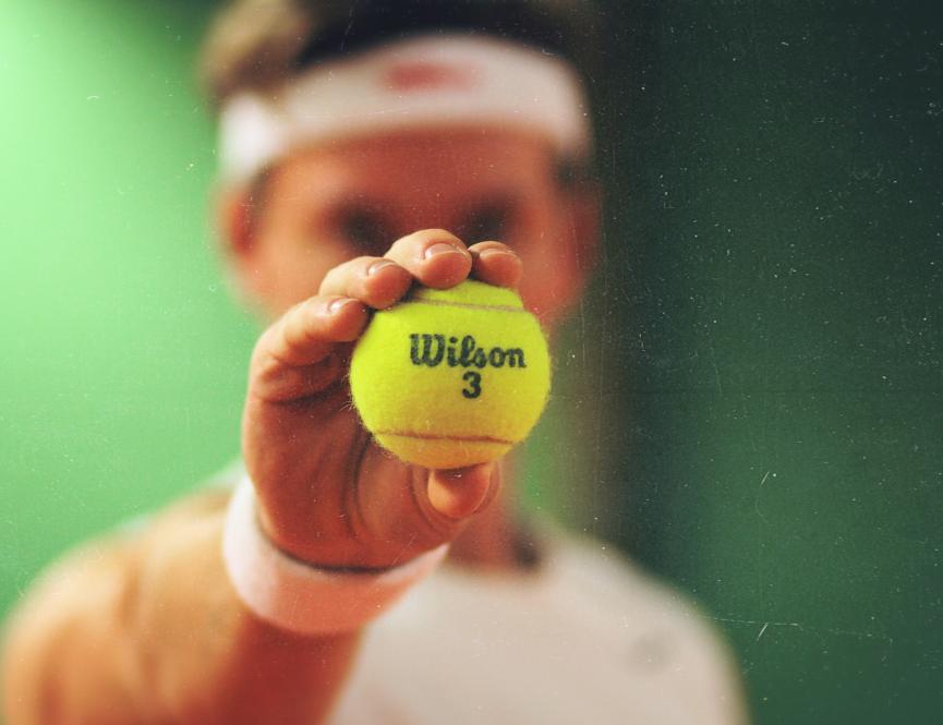 Tennis ball and player