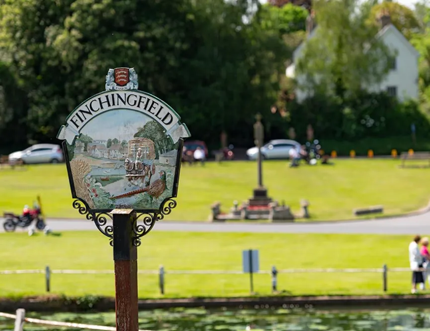 Finchingfield sign with field in the background